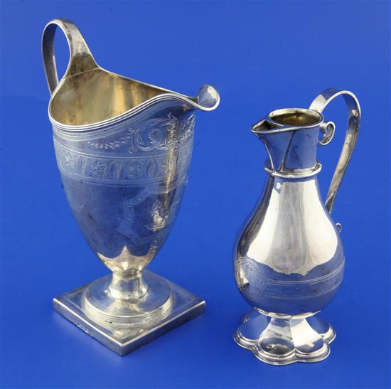 A George III silver helmet shaped cream jug by Alexander Field & later communion jug.